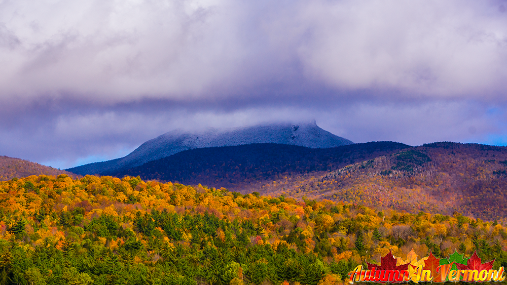 Autumn on with snow on  Camels Hump.